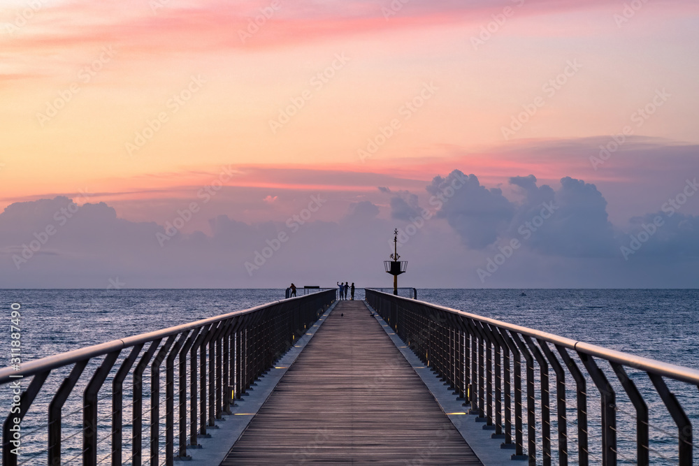 Fototapeta premium Sunrise in a mediterranean harbor. Pont del Petroli, Badalona, Barcelona, Catalonia, Spain