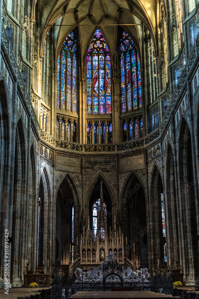 Prague, Czech Republic: Colorful religious stained glass window inside St. Vitus Cathedral