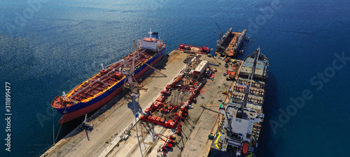Aerial drone ultra wide photo of old industrial shipyard in Mediterranean destination