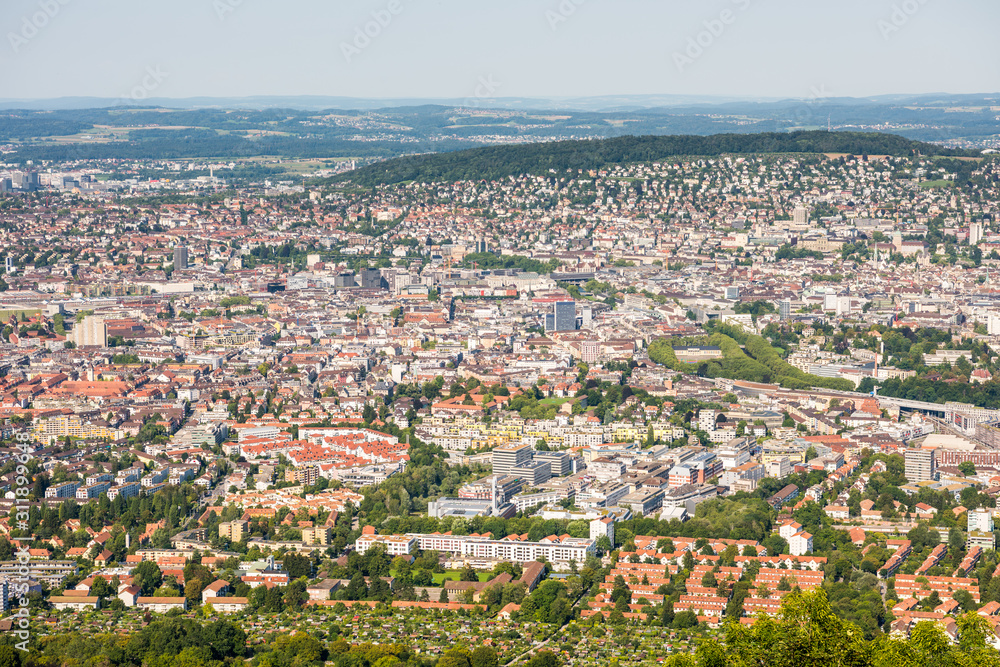Panoramaof old downtown of Zurich city, with beautiful house at the bank of Limmat River, aerial view from the top of Mount Uetliberg