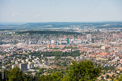 Panoramaof old downtown of Zurich city, with beautiful house at the bank of Limmat River, aerial view from the top of Mount Uetliberg