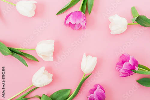 Fototapeta Naklejka Na Ścianę i Meble -  Spring pattern made of white and pink flowers on pink