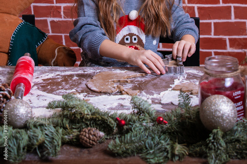 Dough and christmas cookie. Children making christmas cookies in the kitchen