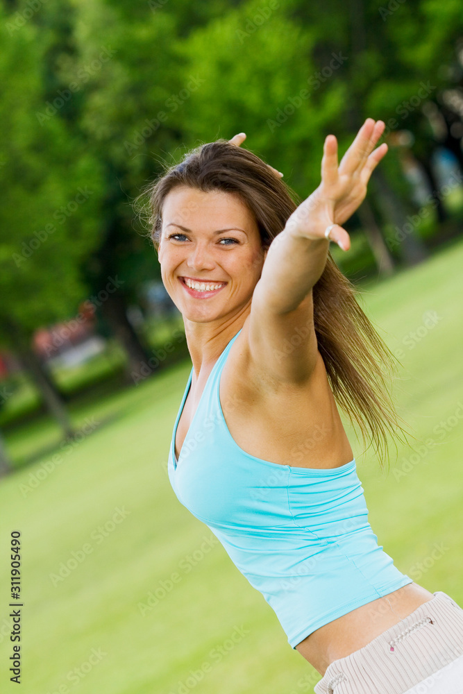 Young woman having fun on a summer day in a park Young woman having fun on a summer day in a park