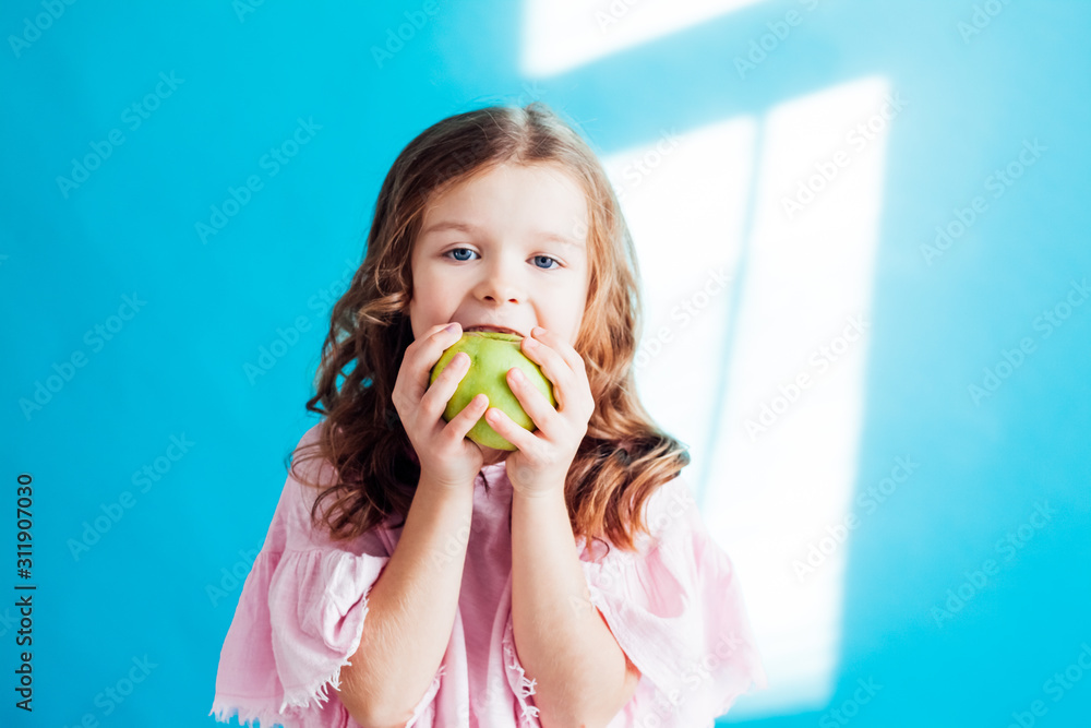 little girl eating ripe Green Apple healthy food little girl eating ripe Green Apple healthy food