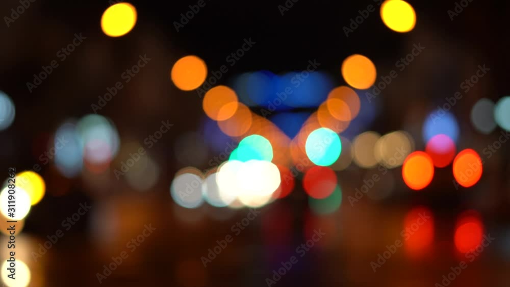 Blurred bokeh traffic on the road at night in a big city. December evening. Blurred bokeh traffic on the road at night in a big city. December evening.