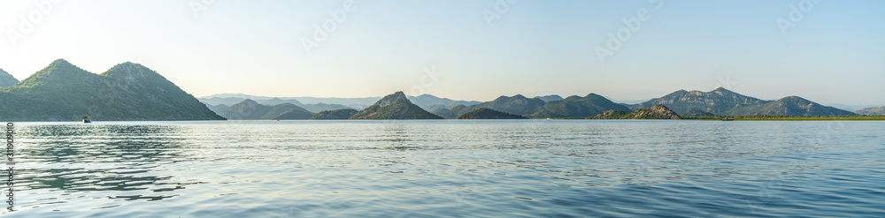 View from a kayak at sunset of Lake Skadar (Scutari Shkodër Shkodra), which lies on the border of Albania and Montenegro, and is the largest lake in Southern Europe.