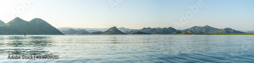 View from a kayak at sunset of Lake Skadar (Scutari Shkodër Shkodra), which lies on the border of Albania and Montenegro, and is the largest lake in Southern Europe.