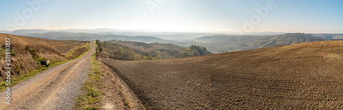 On the path of the Eroica Competition, off-road in tuscany in the chianti hills near siena, italy. The theme of the event is vintage cycling, with participants using vintage (pre-1987) bikes.