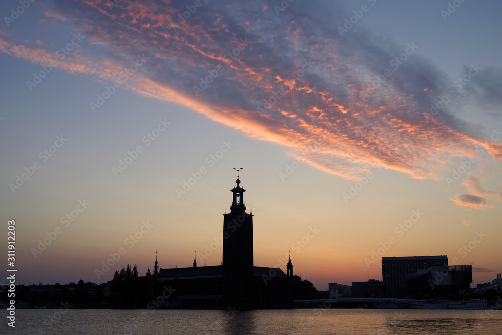 Silhouette of the City Hall at sunset against the evening sky. Stockholm, Sweden.