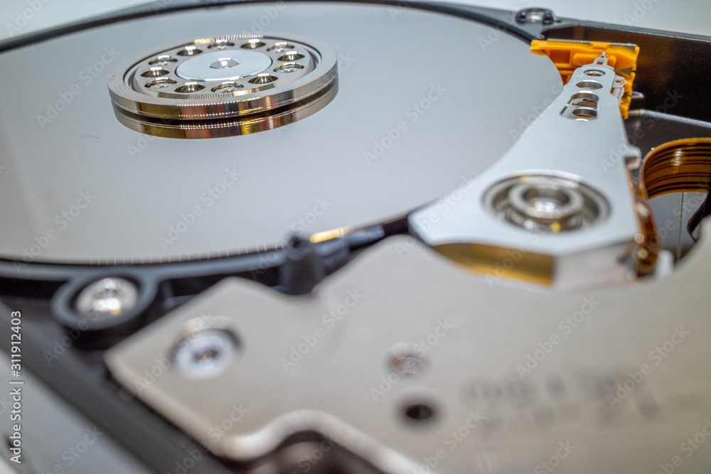 a screwed-on hard disk shows the inner workings of a hard disk a screwed-on hard disk shows the inner workings of a hard disk