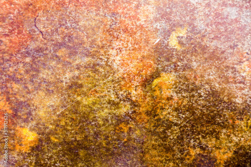 Detail shot of old rusty metal in orange tones