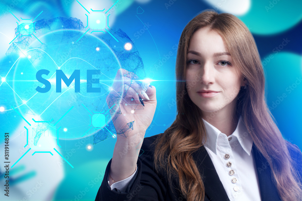 Business, Technology, Internet and network concept. Young businessman working on a virtual screen of the future and sees the inscription: SME Business, Technology, Internet and network concept. Young businessman working on a virtual screen of the future and sees the inscription: SME