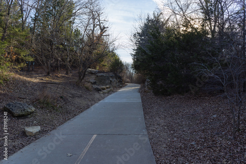 Concrete walkway in a Texas city reserve on a sunny December day. © photocinemapro