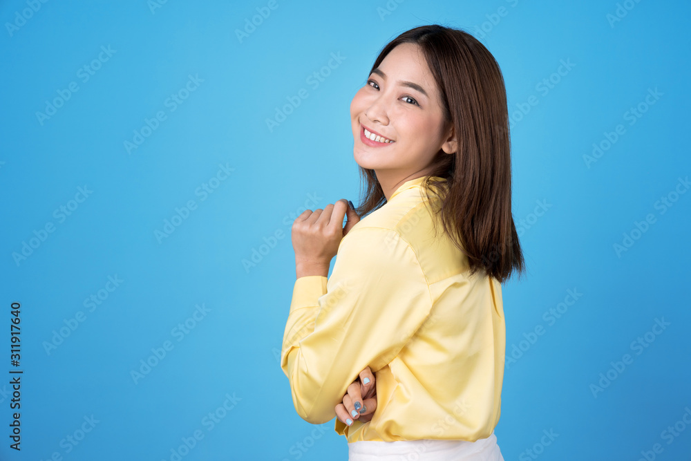 Asian beautiful young woman on blue background. Asian beautiful young woman on blue background.
