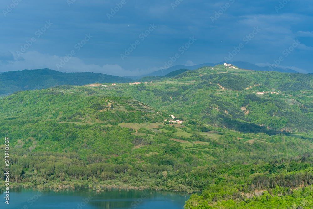 landscape with the Butoniga lake and mountains in Istria, near Motovun, Croatia, Europe. Distant rural villages and cities