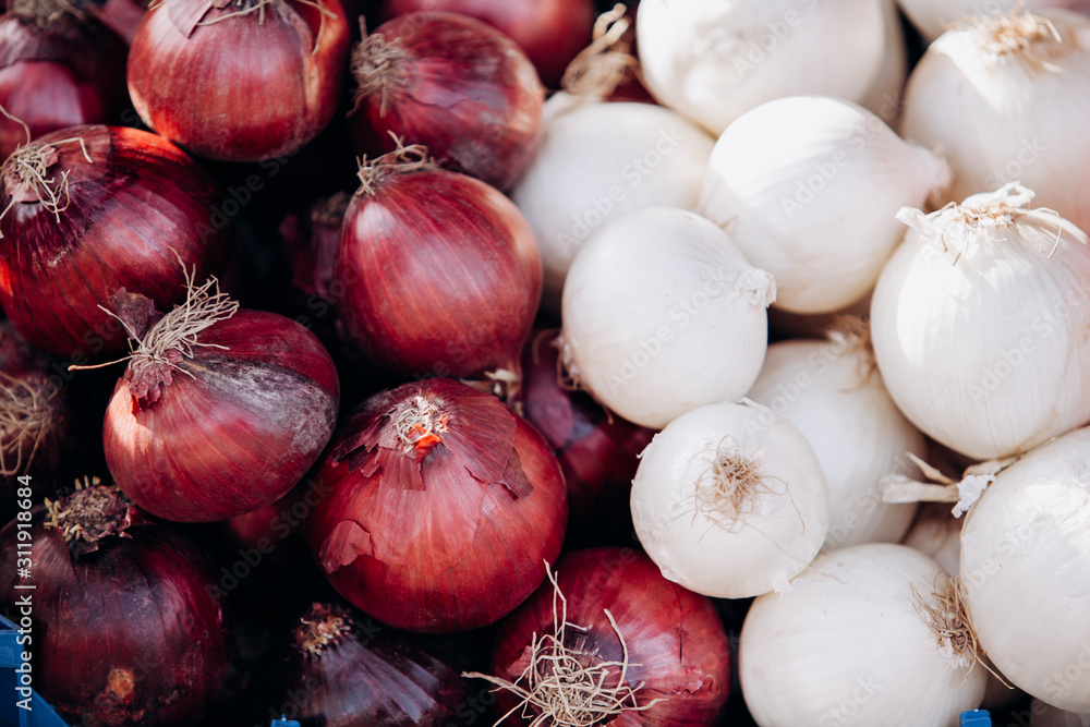 Lots of red and white onions. Background of red and white onions. Raw red and white onions Lots of red and white onions. Background of red and white onions. Raw red and white onions