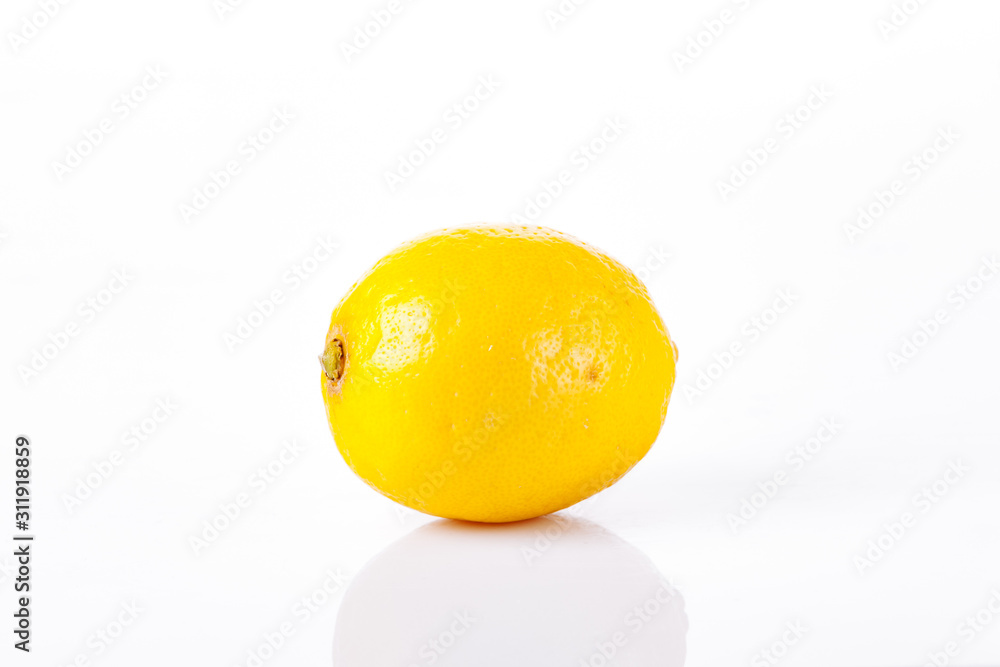 One ripe lemon on a white background One ripe lemon on a white background