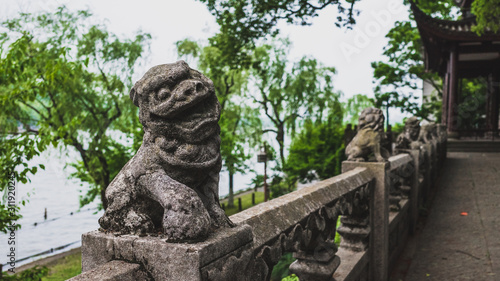 Stone lion by West Lake, Hangzhou, China