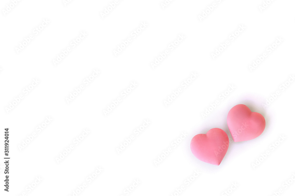 Decoration of Valentine Day. Beautiful pink coral hearts on a white background with space for text. Top view, flat lay