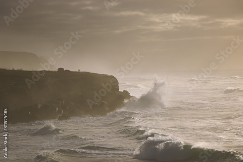 Seascape in a stormy day. Waves crash into the portuguese coastline