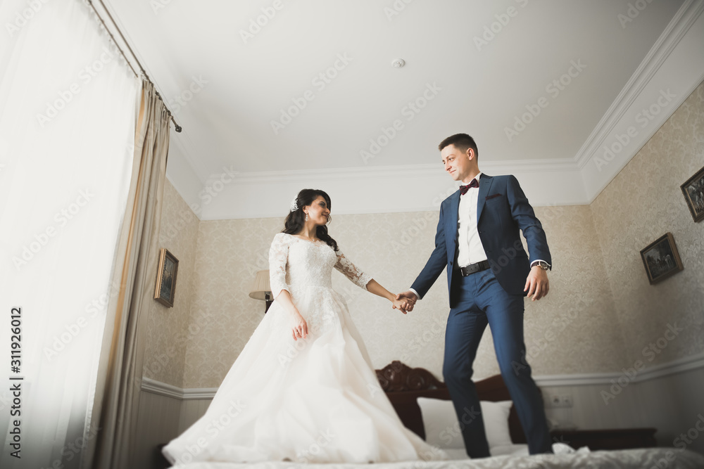 Cute happy bride and groom preparing for wedding Cute happy bride and groom preparing for wedding