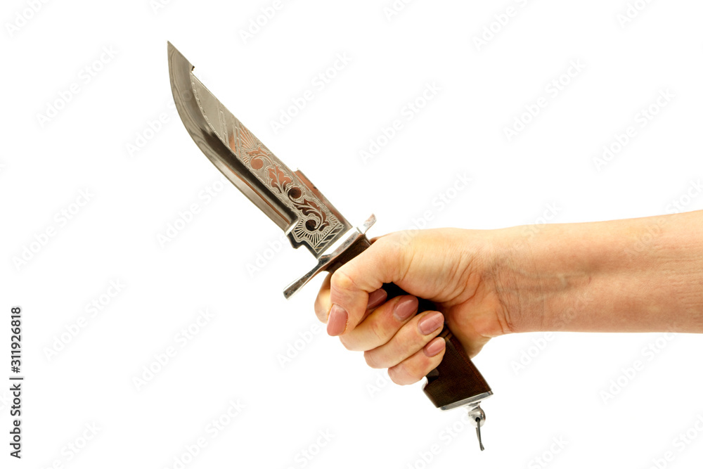 Hunting knife in a female hand isolated on a white background. Dagger in a female hand on a white background. Hunting knife in a female hand isolated on a white background. Dagger in a female hand on a white background.