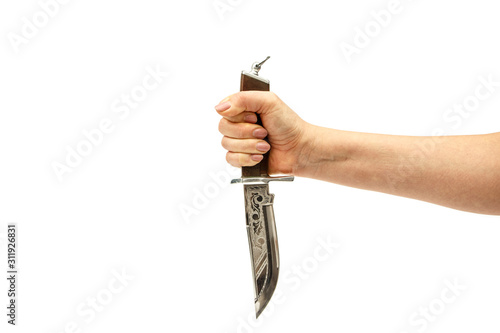 Hunting knife in a female hand isolated on a white background. Dagger in a female hand on a white background.