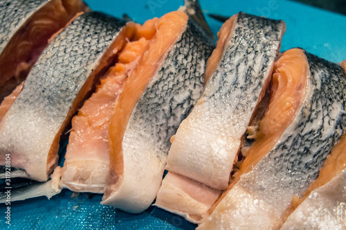 Fresh salmon fish sliced slices of food fillet closeup.