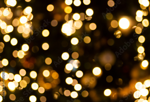 Bokeh lights background. Abstract gold background with soft blur bokeh light effect