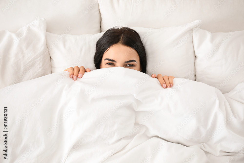 Young woman awakening at home, top view. Lazy morning Young woman awakening at home, top view. Lazy morning