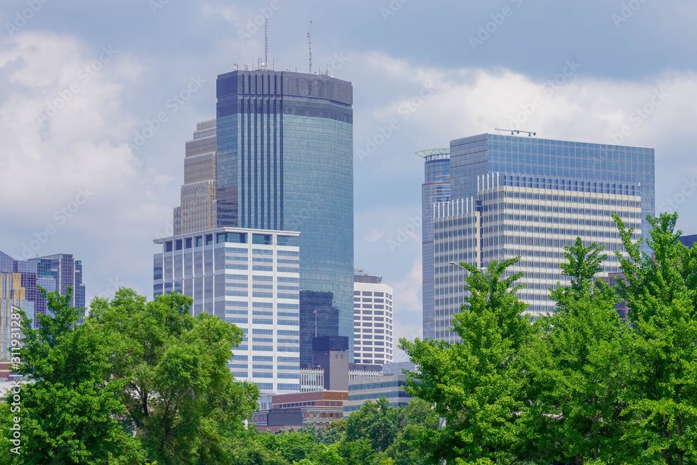 Minneapolis downtown skyline with trees in the summer 