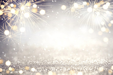 Gold and silver Fireworks and bokeh in New Year eve and copy space. Abstract background holiday.