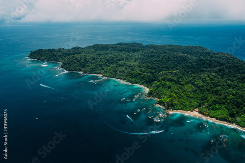 Aerial Drone View of a tropical island with lush jungle in Costa Rica, Isla del Caño