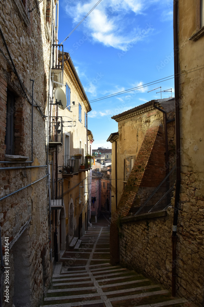 Campobasso, Italy, 24/12/2019. A narrow street between the old buildings of a medieval town