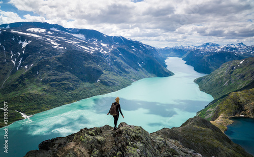 Young woman descending the Besseggen mountain ridge in Jotunheimen, Norway