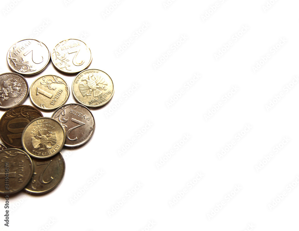 Several Russian coins lie on a white isolated background. Shiny Russian metal money. Place for text. Several Russian coins lie on a white isolated background. Shiny Russian metal money. Place for text.
