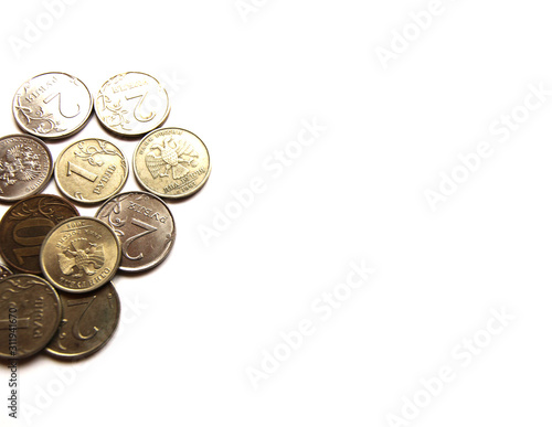 Several Russian coins lie on a white isolated background. Shiny Russian metal money. Place for text.