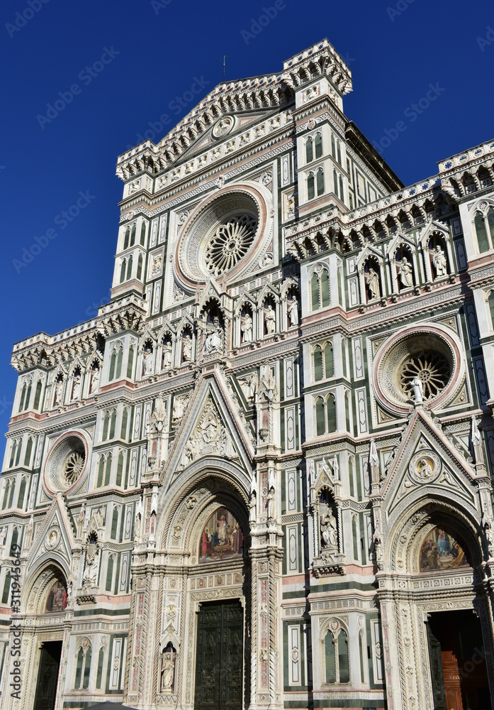 Santa Maria del Fiore Cathedral with blue sky. Facade close-up. Florence, Italy.