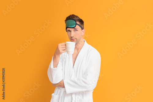 Handsome man in bathrobe, s...