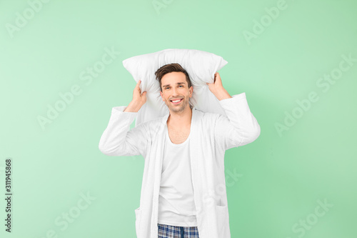 Handsome man in bathrobe an...