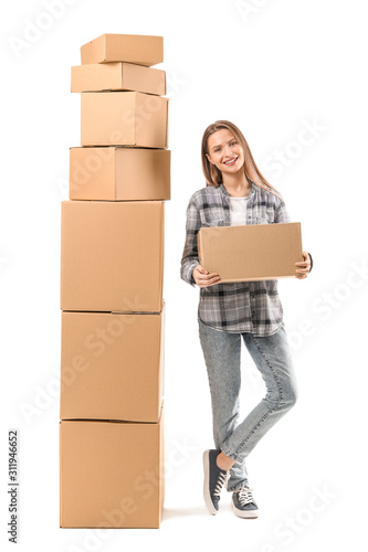 Young woman with moving box...