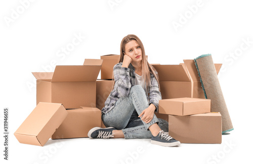 Sad young woman with moving...
