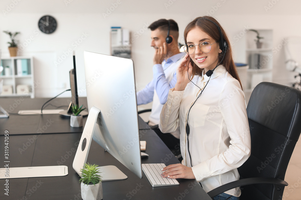 Female technical support agent working in office Female technical support agent working in office