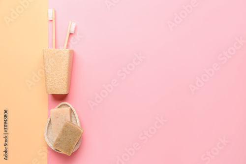 Set of bath accessories on color background