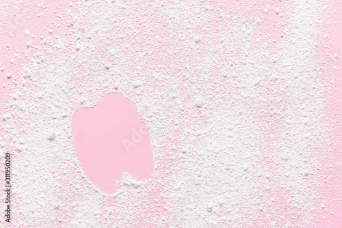 Shape of tooth made of powder on color background