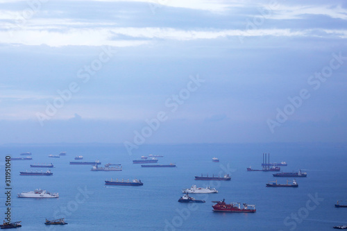 Aerial view of cargo ships in the roadstead. Marine landscape with business or commercial sense.