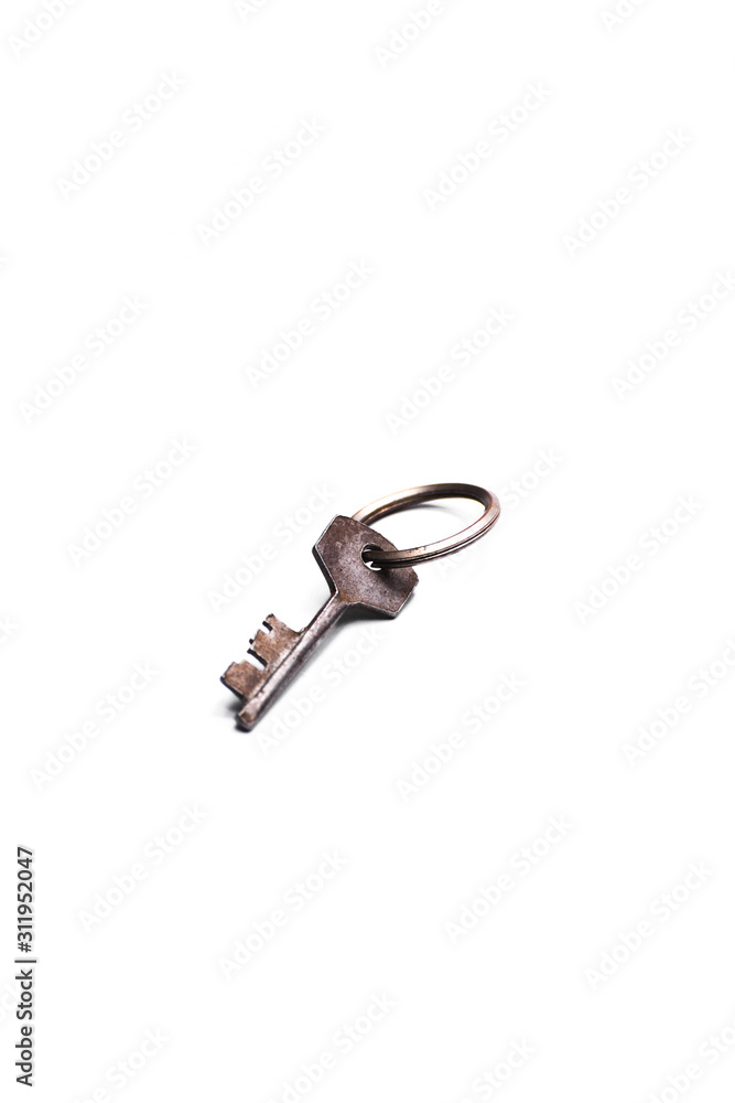 Single old key isolated on white background Single old key isolated on white background