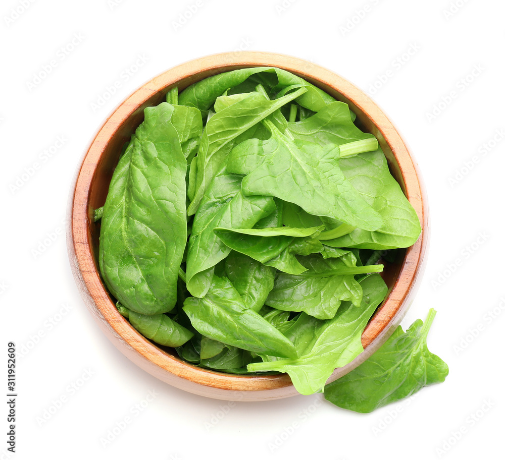 Bowl with fresh spinach on white background