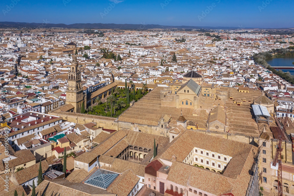 above, drone point of view, aerial view, high up, outdoors, sky, river, spain, road, water, cathedral, tower, old, city, cityscape, europe, ancient, tourism, architecture, andalusia, roman bridge, mos